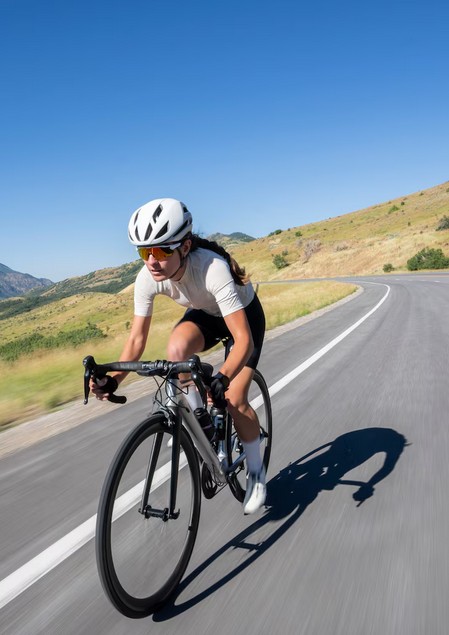woman cyclist on her downhill road bike